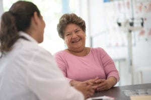 Senior Woman talking with the Doctor