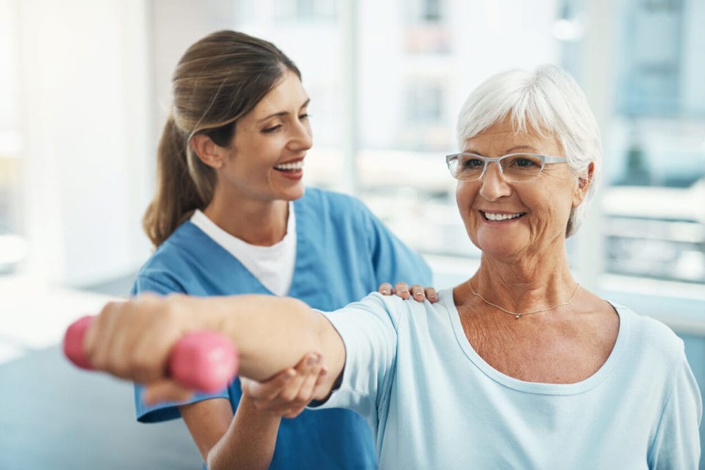 Senior woman getting physical therapy