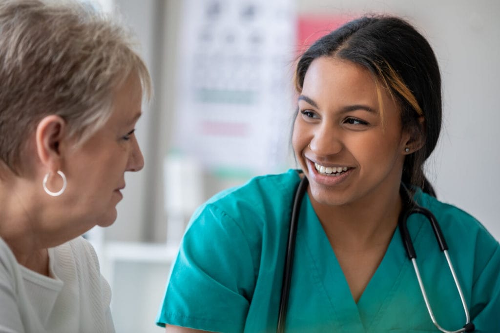 Senior Lady consulting to her medical provider in clinic