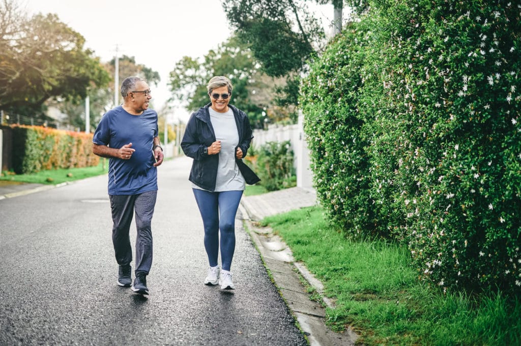 Full length shot of a senior couple bonding together & benefit of regular exercise