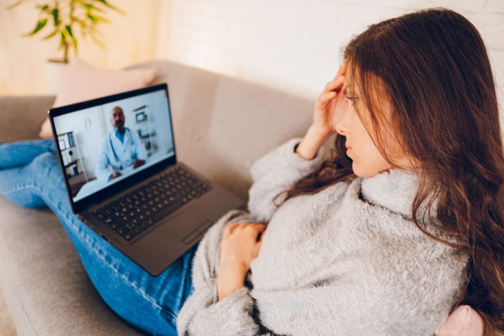 A woman having Video call with doctor