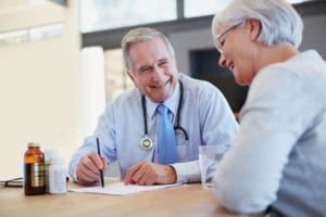Primary Care Physician talking to his elderly patient