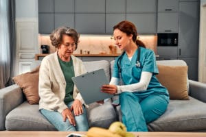 Doctor's home visit to provide healthcare for a senior citizen.