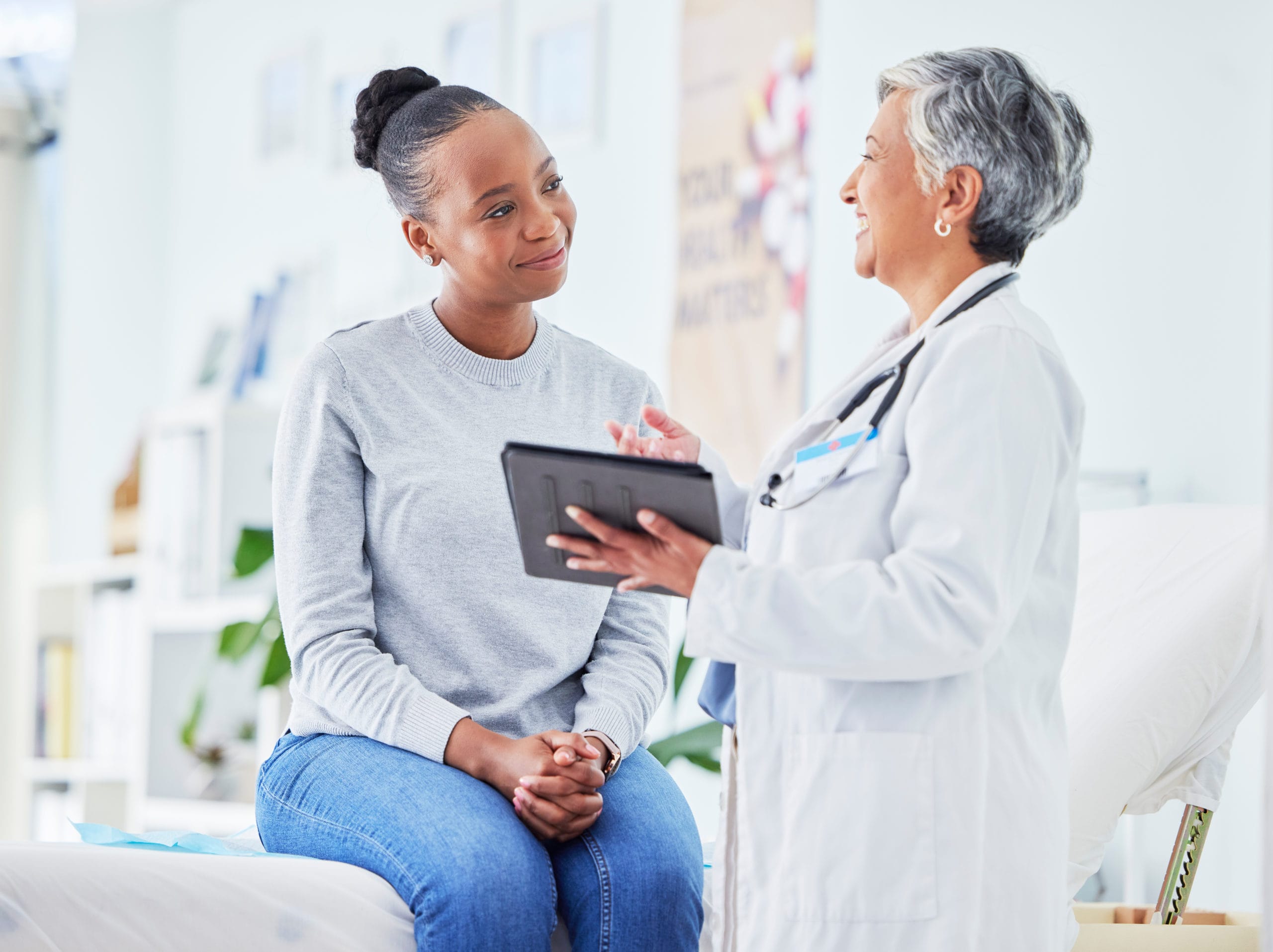 female medical provider talking with patient