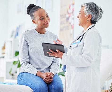 female medical provider talking with patient